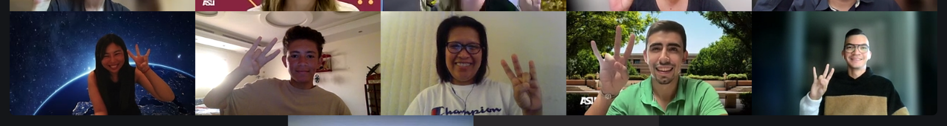 Screenshot of six people in a virtual meeting making a hand gesture with the index, middle finger, and thumb extended.