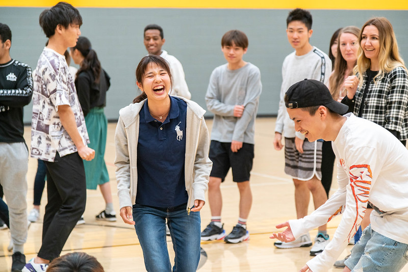 A group of ASU Global Launch students laughing and participating in indoor sports.