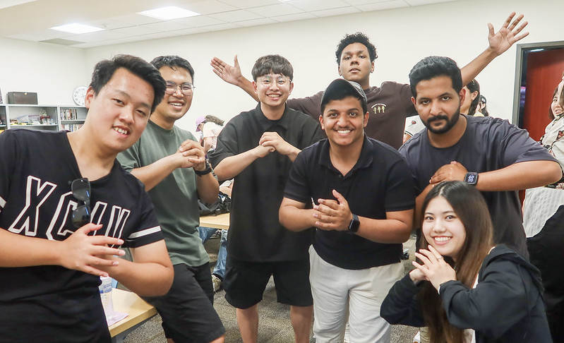 A group of ASU students posing before going to a baseball game.