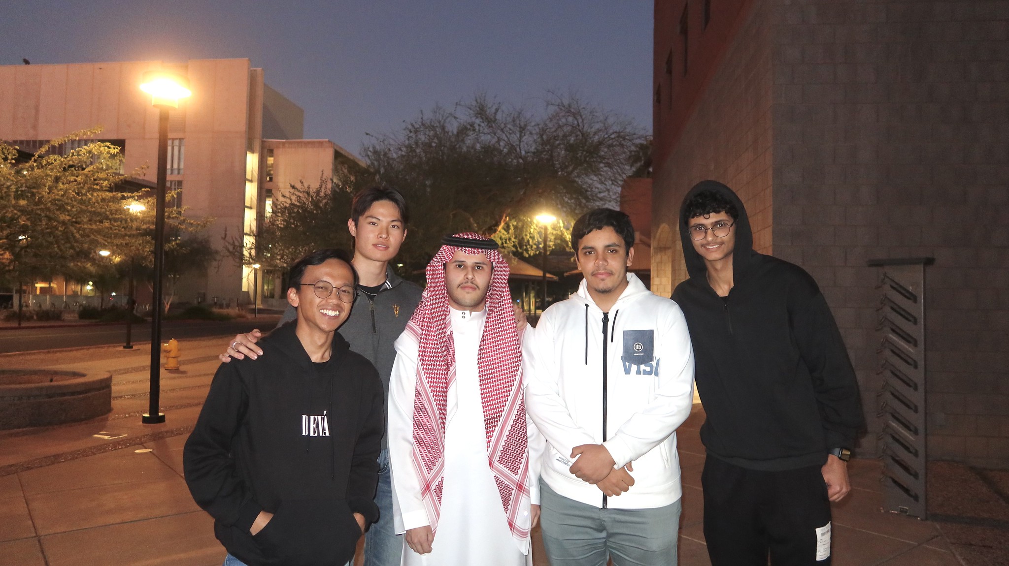 Several ASU Global Launch students pose for a photo during a nighttime activity.