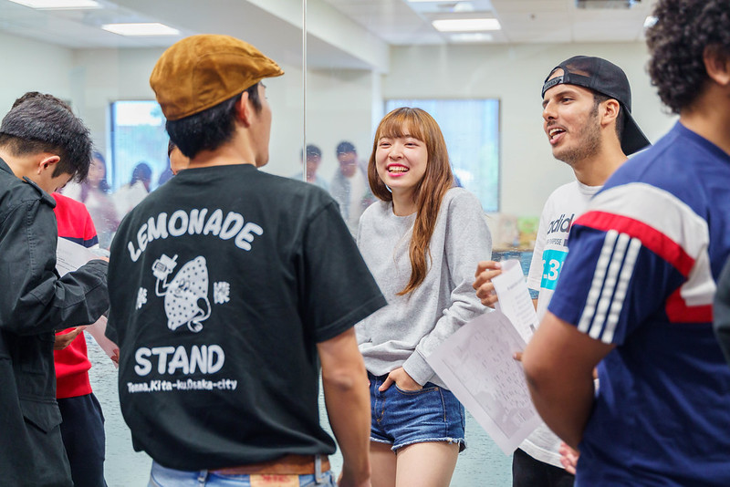 A group of ASU Global Launch students chatting casually in class.